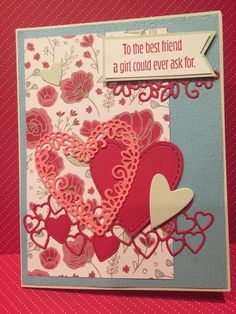 a handmade card with hearts and flowers on the front, says to the best friend a girl could ever ask for