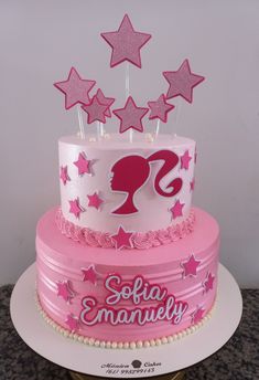 a pink and white birthday cake with stars on the top is for someone's 21st birthday