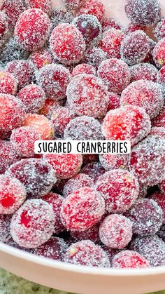 sugared cranberries in a white bowl with the words, sugared cranberries