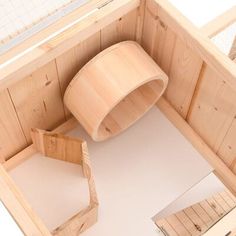 an overhead view of a wooden room with white flooring and wood furniture in it