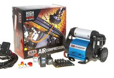 an air compressor is shown in front of a box with wires and other items around it