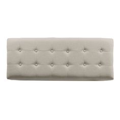 an upholstered headboard with buttons on the top and bottom, in grey linen