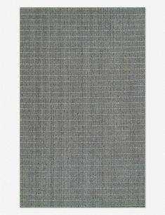 a gray and white rug with small squares on the bottom, in front of a white background