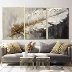 Embrace the sophistication of abstract art with our stunning three-piece set, featuring elegant gold and white textured paintings. Each panel is a masterpiece of design, encased in a sleek metal frame that adds a contemporary edge to your decor. Made with 100% aluminum, these pieces are not only visually striking but also built to last. The use of real unbreakable glass ensures the safety and longevity of the artwork, while the UV printing technique brings out the vibrant colors and intricate de Feathers Wall Art, Panel Artwork, Gold Living Room, Luxurious Home, White Texture, Uv Printing, Texture Painting, Bird Feathers, Three Piece