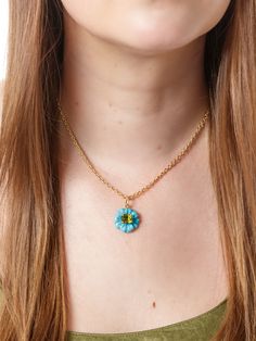 We love this feminine floral charm from Irene Neuwirth. Turquoise is carved in flower design and is centered with a green tourmaline. Shown on Irene's necklace, sold separately. Handcrafted in 18-karat yellow gold. Detailed in carved turquoise, 6.47 cts and green tourmaline, 2.16 cts. Measures 3/4-in. in diameter. Loop measures 5/16-in. long. Turquoise Jewelry With Flower Charm, Green Necklace With Flower Charm And Round Pendant, Green Flower Charm Jewelry With Round Pendant, Green Flower Charm Round Pendant Jewelry, Turquoise Flower Charm Pendant Jewelry, Green Round Pendant Jewelry With Flower Charm, Turquoise Jewelry With Flower Charm As Gift, Turquoise Jewelry With Flower Charm For Gift, Green Pendant Necklace With Flower Charm