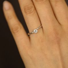 JSVConcepts Fine Jewelry Moissanite Engagement Ring, 0.24 Carat 4.0mm Round Brilliant Cut Engagement Ring, Engagement Ring with Moissanite, Proposal Promise Rings ≫ Product Details ◈ Handmade / Handcrafted Fine Jewelry ◈ Ring Thickness: 1.5mm ~ 2.0mm ◈ 4 Prong setting ◈ Moissanite Color Grade: D E F ◈ Moissanite Clarity Grade: VVS1 ◈ Cut: Brilliant Cut ◈ Metal: 14K Solid Gold (18K also available - Additional fees may apply) ◈ Gold Color: White gold, Rose gold, Yellow gold ≫ Please read our FAQ b Dainty Diamond Ring With Brilliant Cut Lab Grown Diamond, Dainty Lab Grown Diamond Ring With Brilliant Cut, Minimalist Moissanite Diamond Cut Rings, Minimalist Platinum Promise Jewelry, Minimalist White Gold Diamond Ring With Round Cut, Minimalist White Gold Diamond Ring, Minimalist Lab Grown Diamond Ring For Promise, Minimalist Moissanite Wedding Ring, Minimalist 14k White Gold Jewelry With Single Diamond