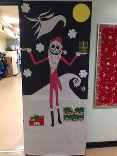 a decorated door in the shape of a santa clause with an image of a skeleton on it