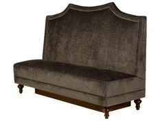 a gray couch sitting on top of a wooden frame