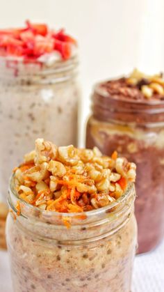 two jars filled with food sitting on top of a table