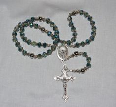 This rosary as are all our beautiful rosaries are carefully and prayerfully built with love. Our hope that it will be used frequently and fervently. Spiritual Rosary With 108 Beads And Crucifix, Faceted Beads Crucifix Rosary As Gift, Healing Rosary With Miraculous Medal And Round Beads, Healing Rosary With Miraculous Medal, Spiritual Cross Rosary With Faceted Beads, Beautiful Rosaries, New Bern, Bern, Rosary