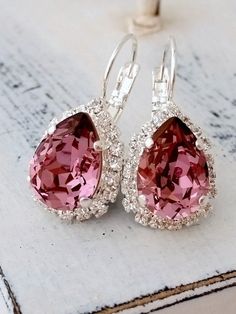 "Antique Pink crystal earrings, Drop earring, European teardrop Halo Earring, Bridal earring, Bridesmaid gift, Dangle earring Silver or gold Elegant and refined. These earrings have a wonderful antique pink center stone surrounded by clear crystal stones - so much sparkle. They would be great as bridal earrings or for any available other day. Perfect gift for bridesmaids or other occasions. They are made of silver plated plated brass posts and Swarovski crystals, all set in prong setting. Made w Pink Drop Earrings, Earring Bridal, Pink Crystal Earrings, Bridal Earring, Pink Things, Earring Silver, Halo Earrings, Antique Pink, Pink Jewelry