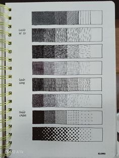 an open notebook with several different patterns on the pages, including lines and dots in black and white