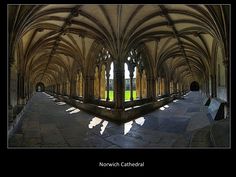 the interior of an old cathedral with stone floors and arched arches, reflecting light on the floor