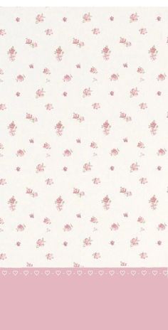 a pink and white wallpaper with hearts and flowers on the bottom half of it