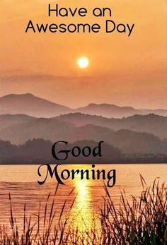 the words have an awesome day good morning are in front of a lake and mountains