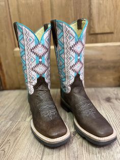 These Roper boots are designed with comfort, durability, quality materials and craftsmanship in mind! When you put these roper boots, you exude timeless western fashion. Burnish Brown Leather Printed Multi Color Aztec Design Square Toe Double Welt Walking Heel Hybrid Outsole REST insole 11" Shaft 1.25" Walking Heel Circumference of Calf: 15" Measurements for this boot were taken from a size 7. Please note that measurements may vary by size. Aztec Cowgirl Boots, Square Toe Cowgirl Boots, Cowgirl Boots Square Toed, Square Toe Western Boots, Roper Boots, Western Store, Brown Square, Native Design, Design Square