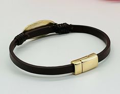 This is an engraved Blessed leather strap bracelet with a magnetic snap closure. The Blessed focal is 1" wide and is metal. By His Grace, Faux Leather Bracelets, Layered Bracelet, Layered Bracelets, Focal Bead, Multi Strand, Magnetic Closure, Snap Closure, Leather Bracelet