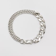 The Soho Bracelet features an 11mm sterling silver curb chain looped together with a 4.5mm sterling silver curb chain. The bracelet is 6", 7", 8", 9", or 10" long.Custom lengths available upon special request. Sterling Silver Bracelets With Chunky Chain In Oval Link, Everyday Sterling Silver Bracelet With Curb Chain, Classic Sterling Silver Chunky Chain Bracelet, Everyday Sterling Silver Bracelet With Chunky Chain, Modern Sterling Silver Chain Bracelet With Curb Chain, Minimalist Silver Cuban Link Bracelet With Curb Chain, Modern Sterling Silver Chunky Chain Bracelet, Classic Sterling Silver Cuban Link Bracelet With Silver Chain, Classic Sterling Silver Cuban Link Bracelet