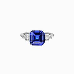 METAL SPECIFICATIONS White Gold 14K STONE SPECIFICATIONS Stone Name : Blue Sapphire and Diamond Stone Cut : Asscher, Radiant and Baguette Stone Details : There is one asscher cut sapphire approx. 1.50 carats (Approx. Size 6.5 x 6.5 mm) and approx. 0.50 carats of diamonds on the sides. Natural earth mined stones. Color : F/G Clarity : VS1/VVS1 Quality of Sapphire : AAA Sapphire Treatment : Heated Total : Approx. 2 Carats RING SPECIFICATIONS Size : 6.5 (Can ship in any size, please send us a messa 2 Carat Ring, Blue Sapphire Ring, Asscher Cut, Blue Sapphire Rings, Natural Blue Sapphire, Natural Earth, Stone Cuts, Baguette Diamond, 2 Carat