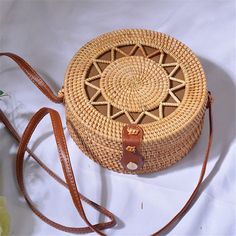 Bali Handmade Woven Rattan Bag Round Straw Shoulder Bag Women Summer New Hollow Out Retro Crossbody Bag Boho Beach Circle Bag Handmade handwoven ratta bean bags.This handcrafted bag is made with hand-harvested material and features a handle for carrying all your essentials. It's soft, lightweight, warm and has a detachable shoulder strap to keep it all together in one place! This bag also comes fully lined so you can carry all the necessities as you go about your shopping or travel. The bag carr Round Straw Bag, Circle Bag, Straw Handbags, Rattan Bag, Handcrafted Bags, Straw Bags, Woven Rattan, Tassel Bag, Types Of Bag