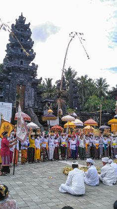 a group of people standing around each other