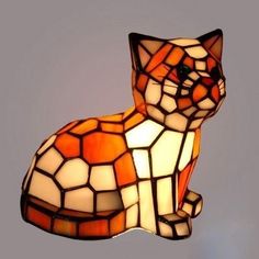 a lamp that has a cat on it