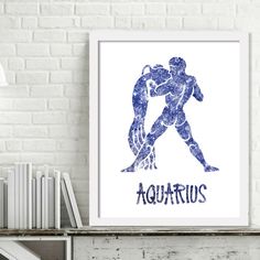 a blue and white poster with the word aquarius on it in front of a brick wall