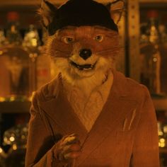 a fox dressed in a suit and hat