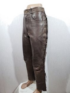 Awesome brown leather pants for men. Brown leather pants with decorative lacing. Great pants made of strong, dense, tan leather. The pants are easily fastened with a metal zipper and a metal button. The pants have a denim cut, so they have two front pockets in the front and two in the back. The pants have decorative lacing. The pants have a pleasant polyester lining. The pants are reliable for riding a motorcycle and will definitely make you stand out from the crowd and draw attention to you. ME Leather Pants For Men, Brown Leather Pants, Riding A Motorcycle, Mens Leather Pants, Pants For Men, Waist Circumference, Pants Length, Metal Zipper, Metal Buttons