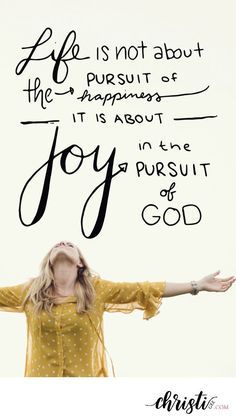 a woman with her arms outstretched in front of a sign that says, life is not about the pursuit at happiness it is about joy in the pursuit of god