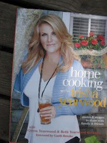 a magazine with a woman holding a drink on top of it's front cover