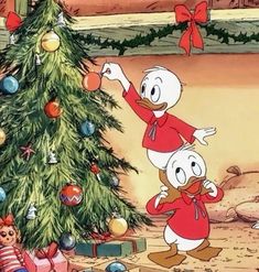 donald duck and daisy duck around the christmas tree