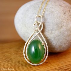 "Here is a beautiful translucent large oval green nephrite jade pendant set with pave diamonds in solid 18KT yellow gold. The jade is set in a double infinity love knott halo setting and is surrounded by pave set round diamonds. The jade is about 14x18mm and is approx. 14.45 carats. The total weight of the brilliant cut round white diamonds is 0.49 carats. The pendant is about 1 1/2\" long. The chain is 14KT gold and is 16\" long. If you do not want the chain, please convo us and we will adjust Elegant Oval Jade Jewelry, Elegant Oval Cabochon Jade Jewelry, Infinity Love, Lucky Green, Halo Setting, Nephrite Jade, Halo Pendant, Jade Pendant, Green Jade