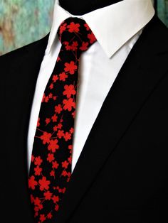 "Men's floral blossom necktie with black background and red flowers. Pocket Square available upon request pending available of fabric cost $10.99 Convo me to check availability. Expertly hand-made from 100% cotton you can select your length from 57\" to 71\" (Great for taller Men). Width is standard 3.5\" as shown here or skinny 2.5\". If you require a custom length or width, please contact us.  2.5\" x 48\" Child size available upon request.  Ships within 2 business days. Made in the USA. CUSTOM ORDERS We love custom orders, so you can also go to www.Fabric.com to select from one of their thousands of cotton fabrics and we can make a tie or bow tie for you. These requests will take at least 2 weeks to fulfill. Any Questions abour this tie, custom orders or bulk quantities, simply hit the Elegant Red Ties For Spring, Elegant Red Spring Tie, Elegant Red Spring Ties, Red Tie For Spring Formal Occasions, Red Ties For Spring Formal Occasions, Red Formal Ties For Spring, Black Ties For Spring, Black Tie For Spring, Make A Tie