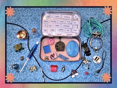 an open suitcase filled with assorted items on top of a blue and green background