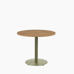 a round wooden table with a metal base on an isolated white background for use in any room