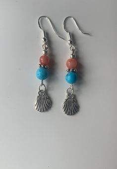 Welcome to LoveForYourPlants Beautiful Blue Turquoise Coral and Silver Sea Shell with Silver Earrings Total Length is Approx. 2 Inches If you have any questions, please feel free to send me a message. Thank you and have a Wonderful day! Beachy Earrings, Sea Shell Earrings, Tropical Earrings, Nautical Earrings, Earrings Nature, Seashell Earrings, Summer Earring, Silver Dangle Earrings, Coral Turquoise