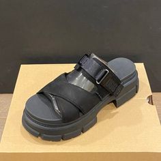 New Ugg Ashton Slide Sandals Color: Black Material: Nubuck Condition: New In Box Heels: 2.25" Black Platform Slide Mules, Modern Black Slides With Open Heel, Modern Black Open Heel Slides, Black Closed Toe Platform Slides, Trendy Black Leather Slides, Ugg Ashton, Black Slide Sandals, Box Heels, Platform Flats