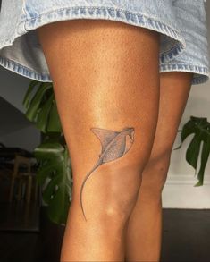 a woman with a tattoo on her leg