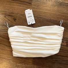 Never Worn Crop Top - Side Zipper Ruched Crop Top For Summer Evenings, Summer Evening Ruched Crop Top, Elegant Ruched Crop Top For Summer, Ruched Bandeau Crop Top For Party, Chic Strapless Ruched Crop Top, Spring Evening Bandeau Crop Top, Elegant Cropped Tube Top For Spring, Spring Evening Crop Tube Top, Orange Drapes