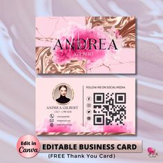 the business card is designed to look like it has pink flowers and gold foil on it