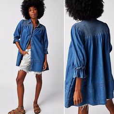 Nwt, Size Xsmall The Free People Vanessa Denim Tunic Blue Chill Is A Women's Tunic Made From Faded Denim Fabric With A Smocked Upper Panel. It Has A Front Button Closure, Elastic Ruffle Cuffs, And Side Seam Pockets Add The Perfect Touch To Any Look With This Essential Denim Tunic Featured In A Classic Button-Front Silhouette With Exaggerated Sleeves And Smocking Throughout For Dimension. This Style Is Intentionally Oversized Spring Indigo Washed Denim Top, Bohemian Medium Wash Denim Top, Medium Wash Recycled Denim Top, Casual Recycled Denim Top For Summer, Spring Indigo Chambray Denim Top, Spring Recycled Denim Medium Wash Top, Medium Wash Recycled Denim Top For Spring, Spring Medium Wash Recycled Denim Top, Casual Recycled Denim Top