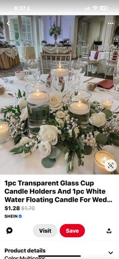 the table is set with candles and flowers on it for a wedding or special event