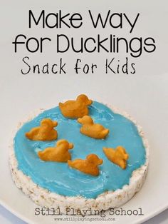 there is a small cake with blue icing and yellow ducks on it that says make way for ducklings snack for kids