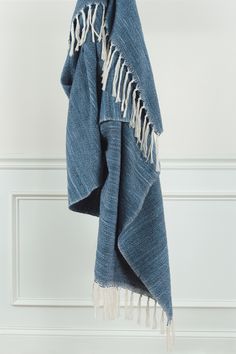 a blue towel hanging on a hook