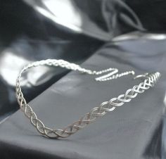 This is a handmade sterling silver plated circlet. Woven from strands of sturdy copper based sterling silver plated metal into a flattering Celtic knot headpiece. Suitable for both Men And Women. To the back is an extender chain and clasp to make this adjustable and fit any head size. Adjustable Elven Style Metal Jewelry, Adjustable Silver Elven Jewelry, Handmade Silver Headband, Silver Adjustable Headband For Festivals, Silver Elven Jewelry For Festivals, Silver Elven Style Jewelry For Festivals, Adjustable Silver Crown Headpiece, Adjustable Silver Crown Headband, Adjustable Silver Headband