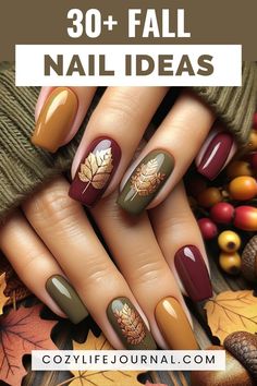 A hand displaying nails painted with fall-themed designs including leaves and acorns, against a backdrop of autumn leaves and berries. Burgundy Nails With Fall Leaves, Fall Color Nails Autumn Gel, Autumn Manicure Ideas, Fall Nail Manicure Ideas, Fall Mustard Nails, Fall Nails Different Color Each Nail, Professional Fall Nails, Fall Nails With Flowers, Fall Nail Designs For Short Nails