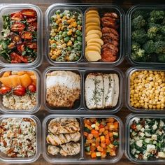 several plastic containers filled with different types of food