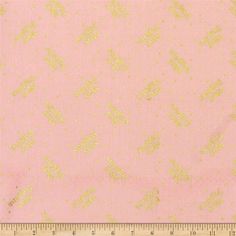 a pink and gold background with small white dots on the bottom, in front of a ruler