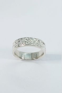 This stunning handmade/hand engraved unisex/any occasion band has been carefully crafted in solid 925 sterling silver. This beautiful band will not go unnoticed. Ring is size 7 but can be resized at no extra cost. A personalized message can be added to the inside of the ring such as your special date or any other message. All of my jewelry is handmade from scratch, one item at a time, as I like to produce a high quality piece. Ring will be shipped to you in an elegant gift box. A tracking shippi Ceremonial Sterling Silver Engraved Carved Ring, Anniversary Band Engraved Ring, Heirloom Carved Sterling Silver Engraved Ring, Adjustable Wide Band Engraved Ring, Traditional Engraved Sterling Silver Ring, Ceremonial Silver Engraved Ring, Silver Engraved Bands For Anniversary, Silver Engraved Carved Ring For Anniversary, Silver Carved Engraved Ring For Anniversary